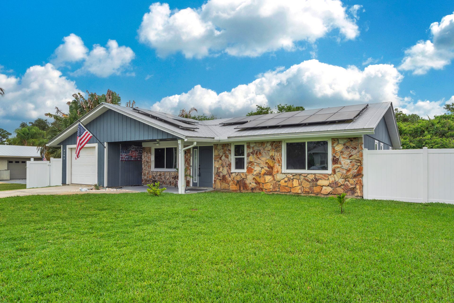 Front exterior and landscaped front yard
